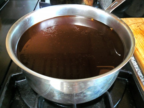 Simmering the veal stock thickens it