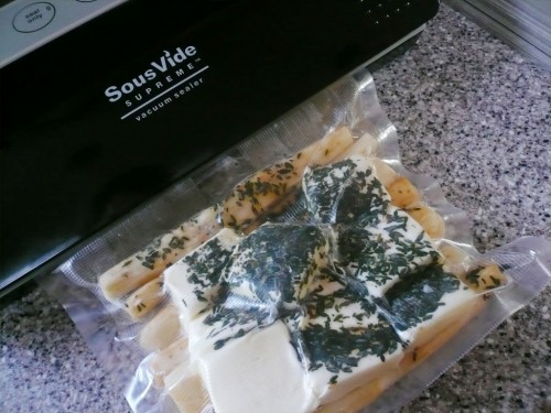 Sealing a bag of salsify with butter and herbs with my SousVide Supreme vacuum sealer