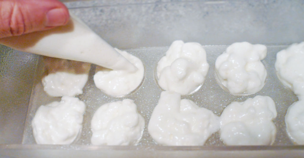 Filling the mold with a pastry bag